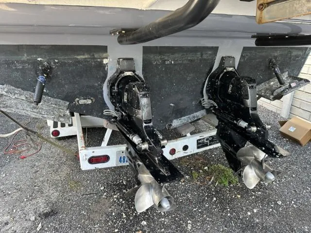 Slide: The Image of 2017 Sea Ray Sundancer 350 Coupe boat with dual propellers on a trailer. - 21