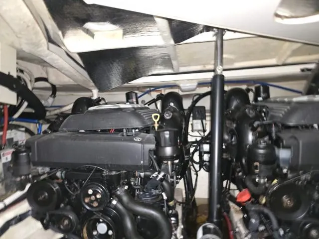 Slide: The Image of Engine room of 2017 Sea Ray Sundancer 350 Coupe with dual engines. - 24