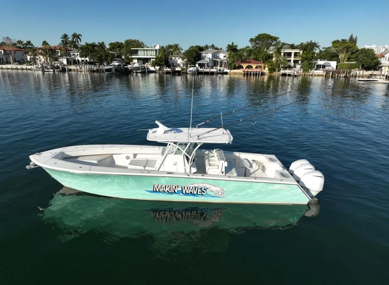 The Image of 2016 SeaHunter 41 Tournament boat on calm water, labeled "Makin' Waves." - 1