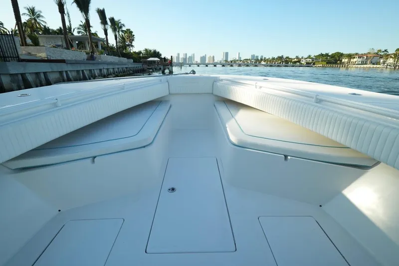 Slide: The Image of 2016 SeaHunter 41 Tournament boat, spacious deck, waterfront view, clear sky. - 22