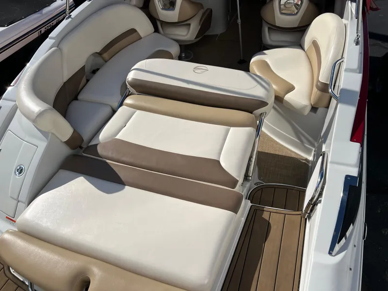 Slide: The Image of 2013 Crownline Q4 boat interior with beige and white seating. - 6