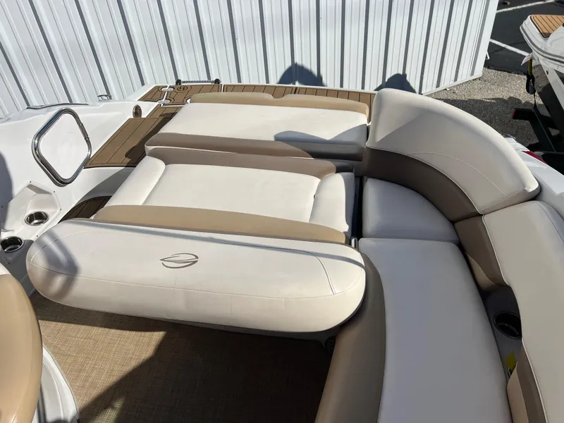 Slide: The Image of 2013 Crownline Q4 boat interior with beige and brown seating. - 7