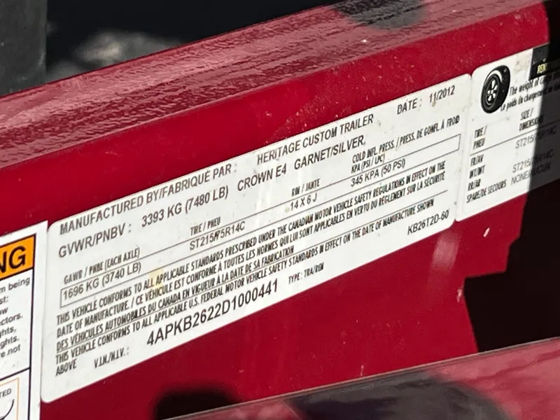 Slide: The Image of Label on a red 2013 Crownline Q4 trailer, detailing specifications and manufacturing information. - 20