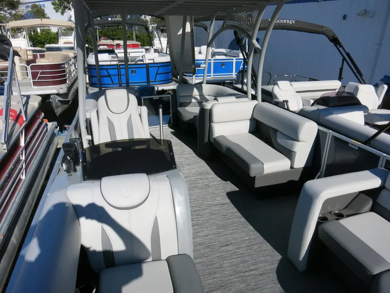 Slide: The Image of 2024 Godfrey Monaco 235SD pontoon boat with spacious seating and modern design. - 10