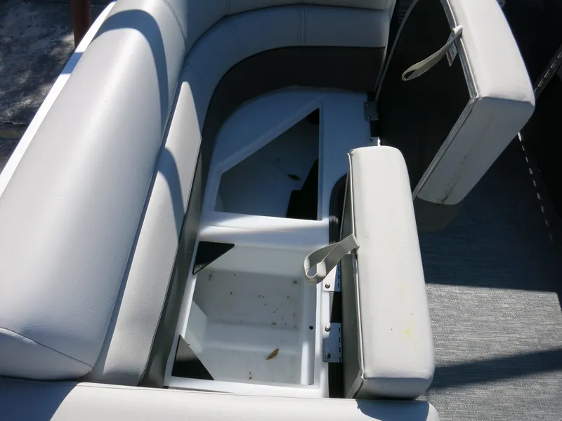 Slide: The Image of 2024 Godfrey Monaco 235SD boat seat with open storage compartment. - 14