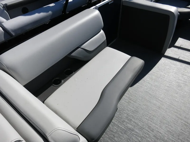 Slide: The Image of 2024 Godfrey Monaco 235SD boat interior seating with cup holders. - 18