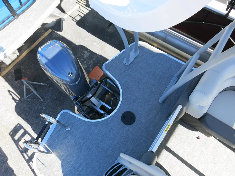 Slide: The Image of 2024 Godfrey Monaco 235SD boat with outboard motor and deck view. - 24