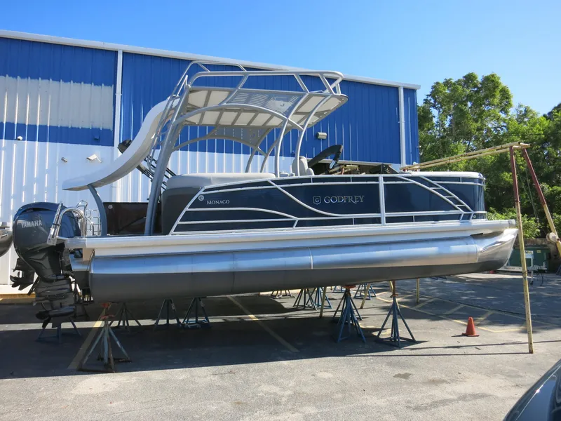 Slide: The Image of 2024 Godfrey Monaco 235SD pontoon boat on display, featuring Yamaha outboard motor. - 4