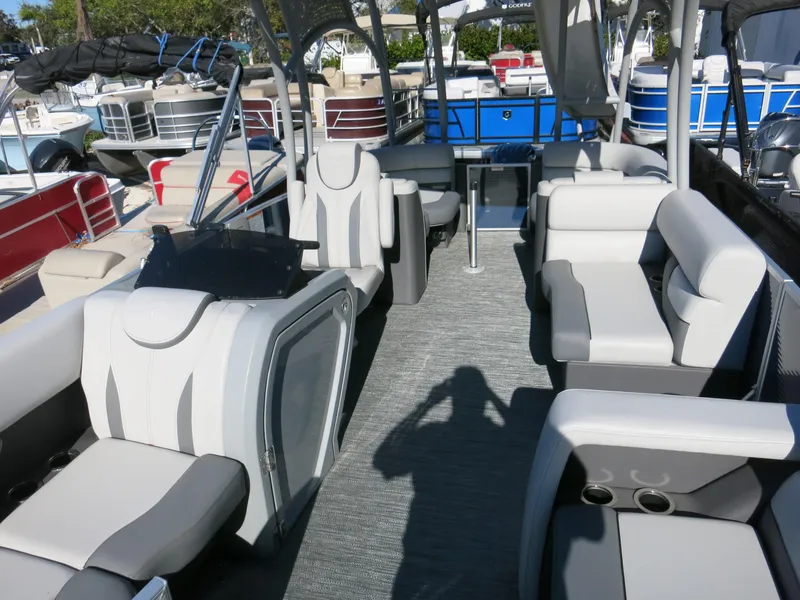 Slide: The Image of 2024 Godfrey Monaco 235SD pontoon boat interior with modern seating and helm. - 9