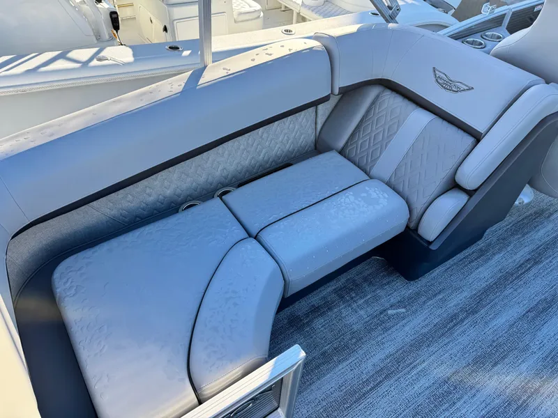 Slide: The Image of 2025 Bennington 24 MFB boat interior with luxurious gray seating and elegant design. - 10