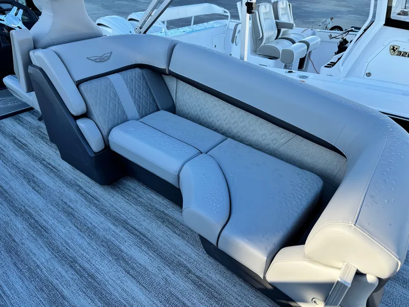 Slide: The Image of 2025 Bennington 24 MFB boat interior with luxurious gray seating. - 12