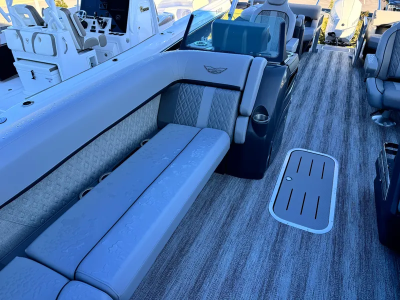 Slide: The Image of 2025 Bennington 24 MFB boat interior with luxurious seating and modern design. - 19