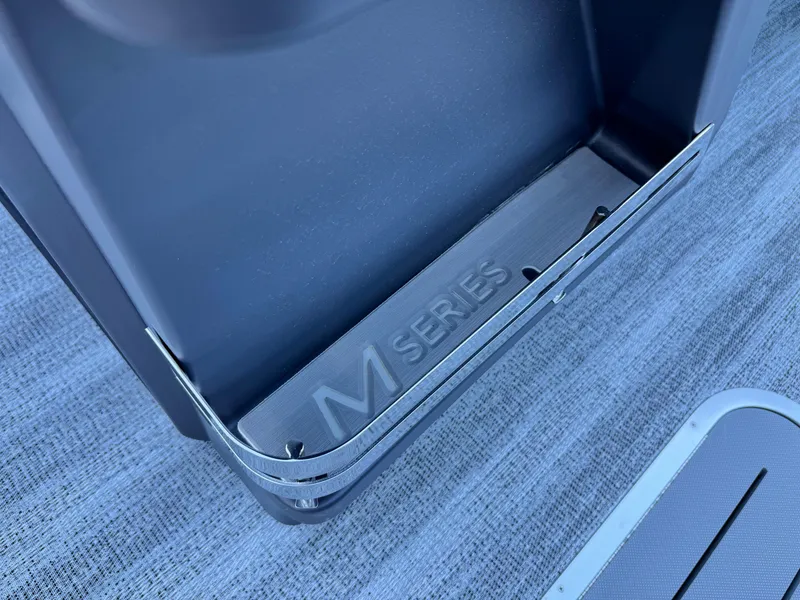 Slide: The Image of Bennington 24 MFB 2025 M Series detail, sleek design on textured surface. - 24