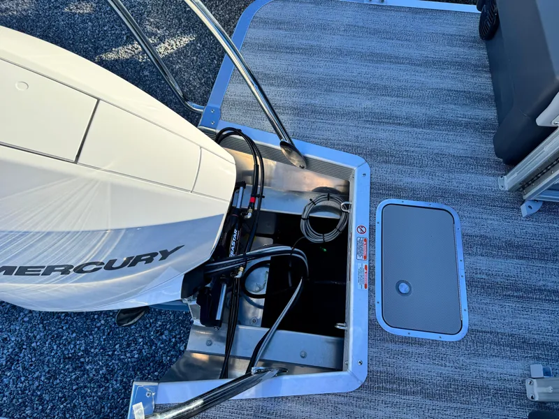 Slide: The Image of 2025 Bennington 24 MFB boat with Mercury engine and deck details. - 7