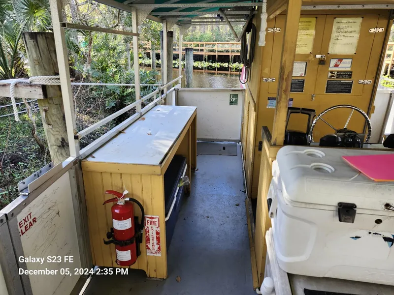 Slide: The Image of Interior of 2016 Rover Marine Carolina Rover 40 boat with safety equipment and controls. - 11