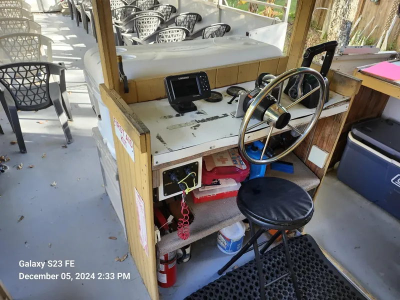 Slide: The Image of 2016 Rover Marine Carolina Rover 40 helm with navigation equipment and seating area. - 14