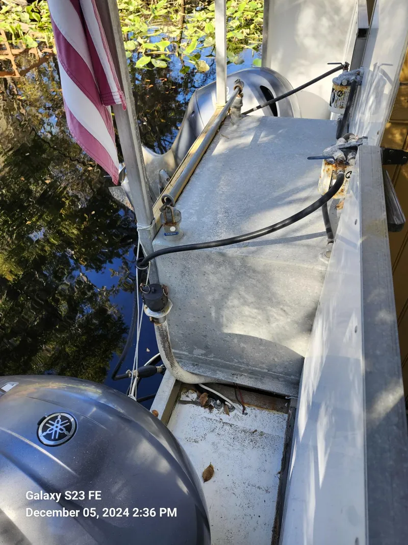 Slide: The Image of 2016 Rover Marine Carolina Rover 40 boat deck with Yamaha motor and American flag. - 16