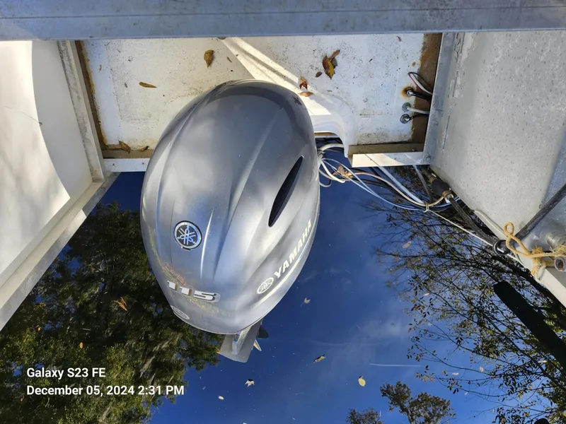 Slide: The Image of Silver Yamaha outboard motor on a 2016 Rover Marine Carolina Rover 40 boat. - 19