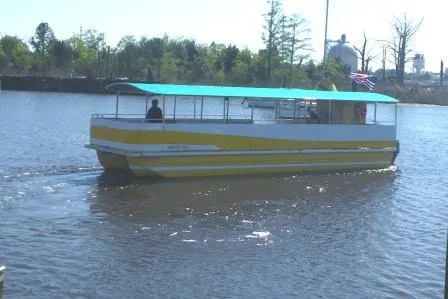 Slide: The Image of 2016 Rover Marine Carolina Rover 40 boat cruising on a calm river. - 2