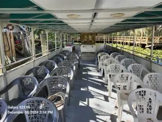 Slide: The Image of Interior of 2016 Rover Marine Carolina Rover 40 with rows of plastic seating. - 6