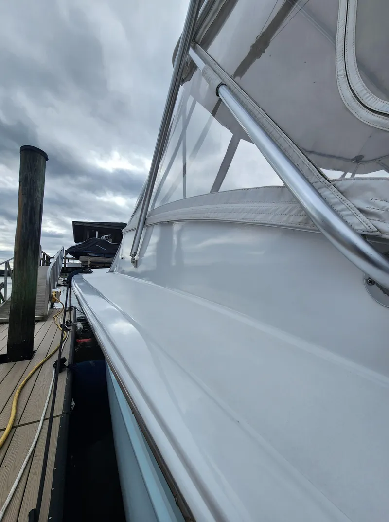Slide: The Image of 1996 Jersey Devil boat docked under cloudy skies. - 12