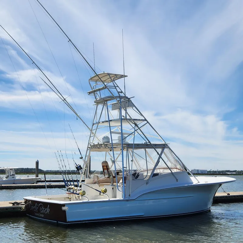 Slide: The Image of Sport fishing boat docked under clear sky, Jersey Devil 1996 model. - 2