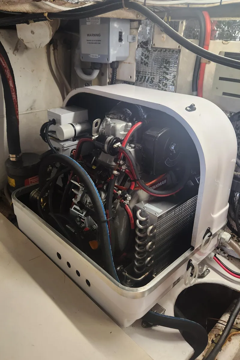 Slide: The Image of 1996 Jersey Devil engine compartment with visible wiring and components. - 28