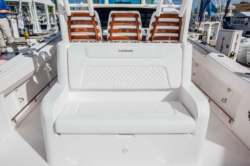 Slide: The Image of Caymas 401 CC 2021 boat interior with white seating and wooden accents. - 12