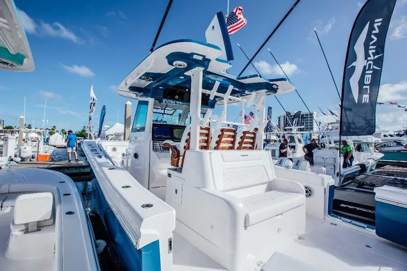 Slide: The Image of 2021 Caymas 401 CC boat at marina, featuring sleek design and comfortable seating. - 20