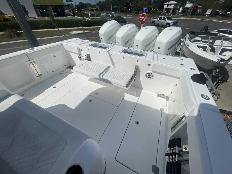 Slide: The Image of 2021 Caymas 401 CC boat deck with quad outboard motors. - 25