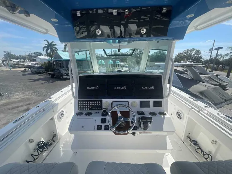 Slide: The Image of 2021 Caymas 401 CC boat helm with Garmin navigation system and modern controls. - 27