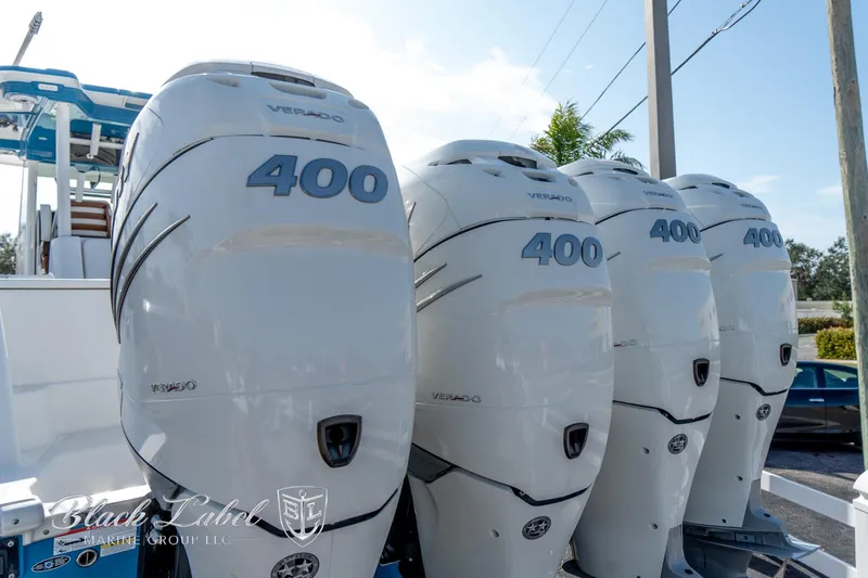 Slide: The Image of Four powerful outboard engines on a 2021 Caymas 401 CC boat. - 4