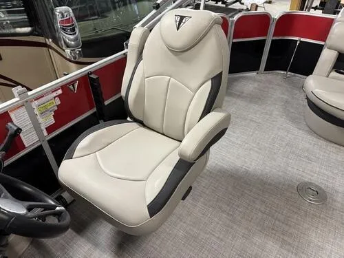 Slide: The Image of 2022 Forest River Trifecta boat seat with beige upholstery and black accents. - 10
