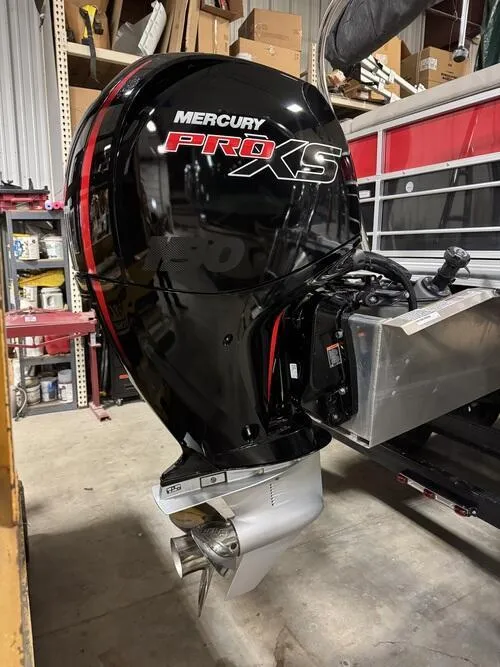 Slide: The Image of Mercury Pro XS outboard motor on 2022 Forest River Trifecta boat in a workshop. - 5