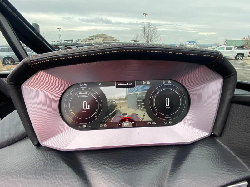 Slide: The Image of 2022 MasterCraft XT24 dashboard with digital display, showcasing speed and navigation features. - 12