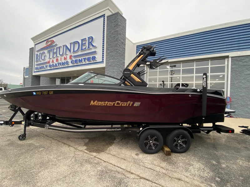Slide: The Image of 2022 MasterCraft XT24 boat at Big Thunder Marine dealership. - 2