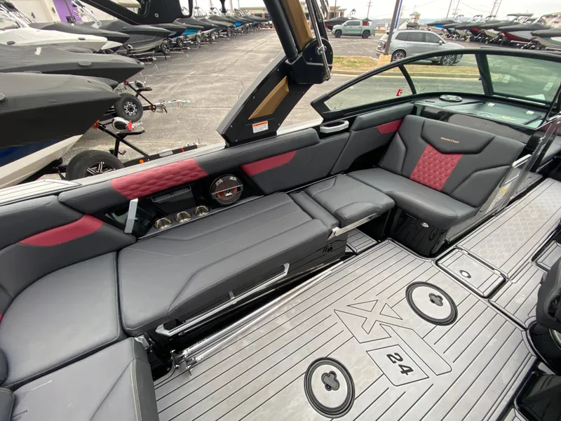 Slide: The Image of 2022 MasterCraft XT24 boat interior with sleek seating and modern design. - 20