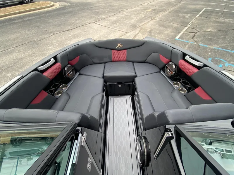 Slide: The Image of 2022 MasterCraft XT24 boat interior with luxurious seating and modern design. - 23