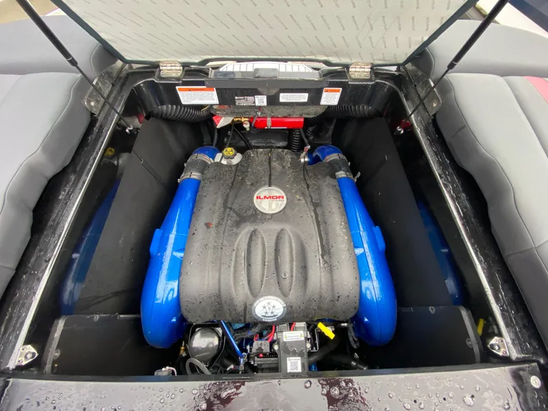 Slide: The Image of 2022 MasterCraft XT24 engine compartment with blue accents and Ilmor branding. - 29