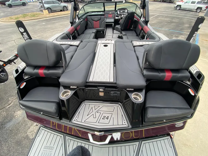 Slide: The Image of 2022 MasterCraft XT24 boat interior with luxurious seating and modern design. - 8