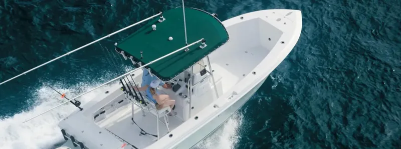 Slide: The Image of 2025 Bluewater 2150 boat cruising on open water, top view. - 1