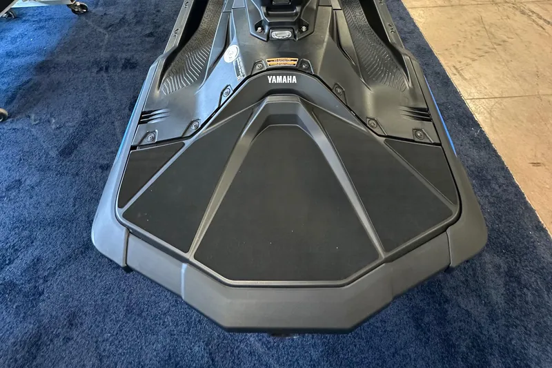 Slide: The Image of 2025 Yamaha WaveRunner JetBlaster, black, on blue carpet, top view. - 3