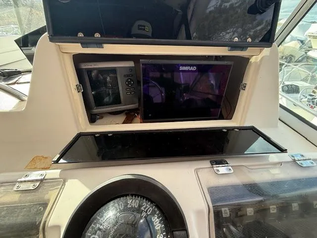 Slide: The Image of Grady-White 232 Gulfstream 2002 boat dashboard with Simrad navigation system. - 10