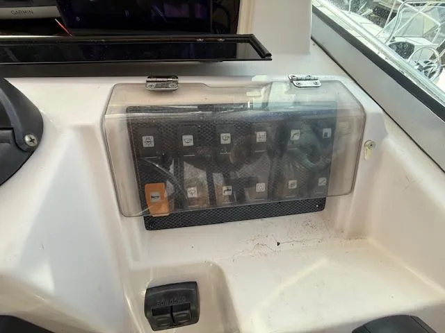 Slide: The Image of Control panel of a 2002 Grady-White 232 Gulfstream boat. - 12