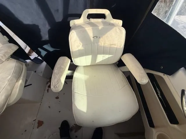 Slide: The Image of White captain's chair on 2002 Grady-White 232 Gulfstream boat. - 15