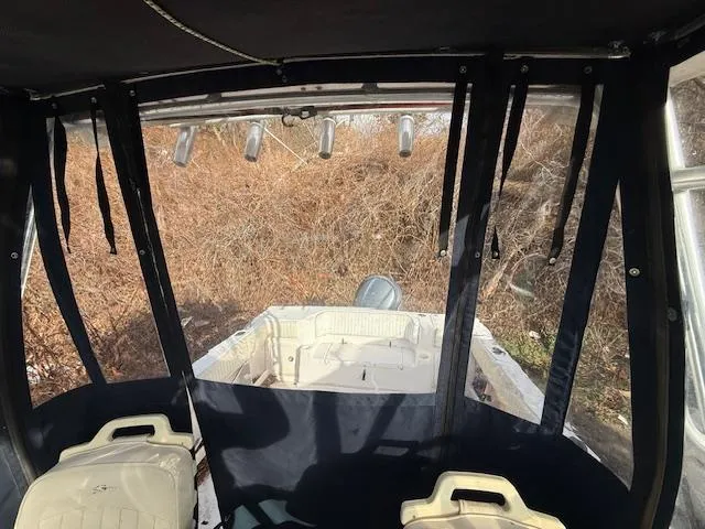 Slide: The Image of Interior view of 2002 Grady-White 232 Gulfstream boat with canopy and seating. - 17