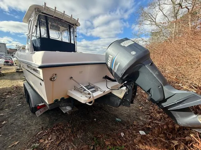Slide: The Image of 2002 Grady-White 232 Gulfstream boat with Yamaha outboard motor, parked outdoors. - 3