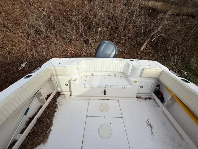 Slide: The Image of 2002 Grady-White 232 Gulfstream boat interior with seating and storage compartments. - 6