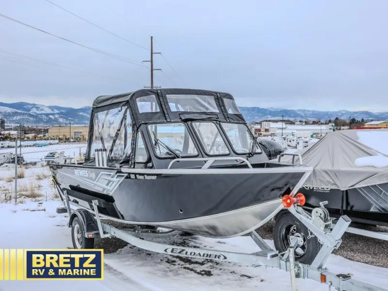 Slide: The Image of 2025 River Runner 180 boat on trailer in snowy landscape at Bretz RV & Marine. - 1