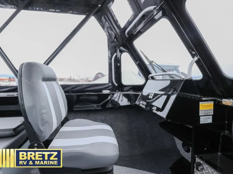 Slide: The Image of Interior of 2025 River Runner 180 boat with gray seating, showcased by Bretz RV & Marine. - 10